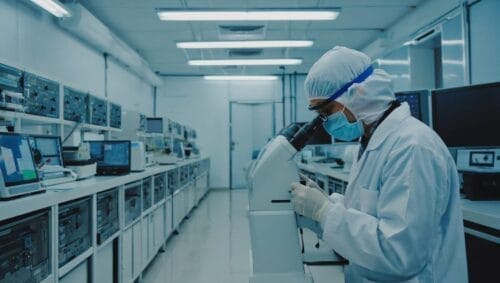 A person in lab performing genome testing that helps addiction treatment